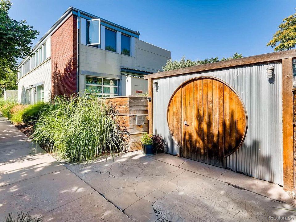 1421 Oneida Street, Unit 7 Denver, CO 80220 - Photo 18 of 22 a view of swimming pool with barbeque and wooden fence