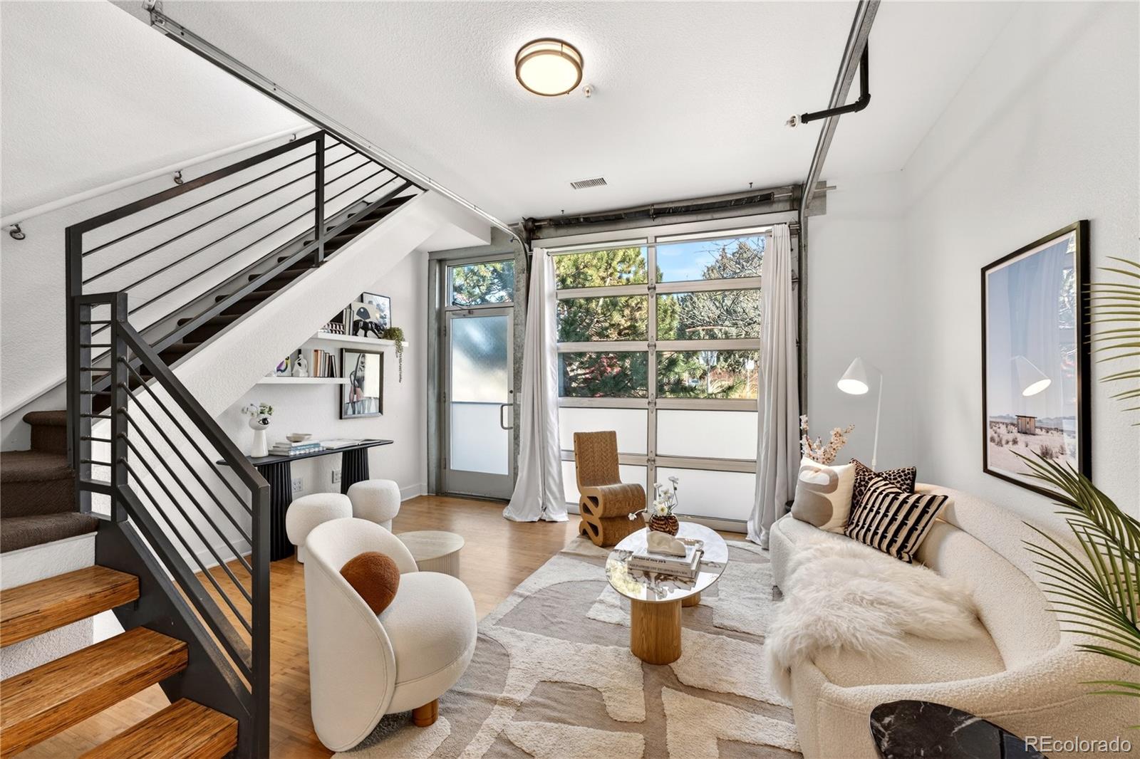 1421 Oneida Street, Unit 7 Denver, CO 80220 - Photo 2 of 22 a living room with furniture and a large window