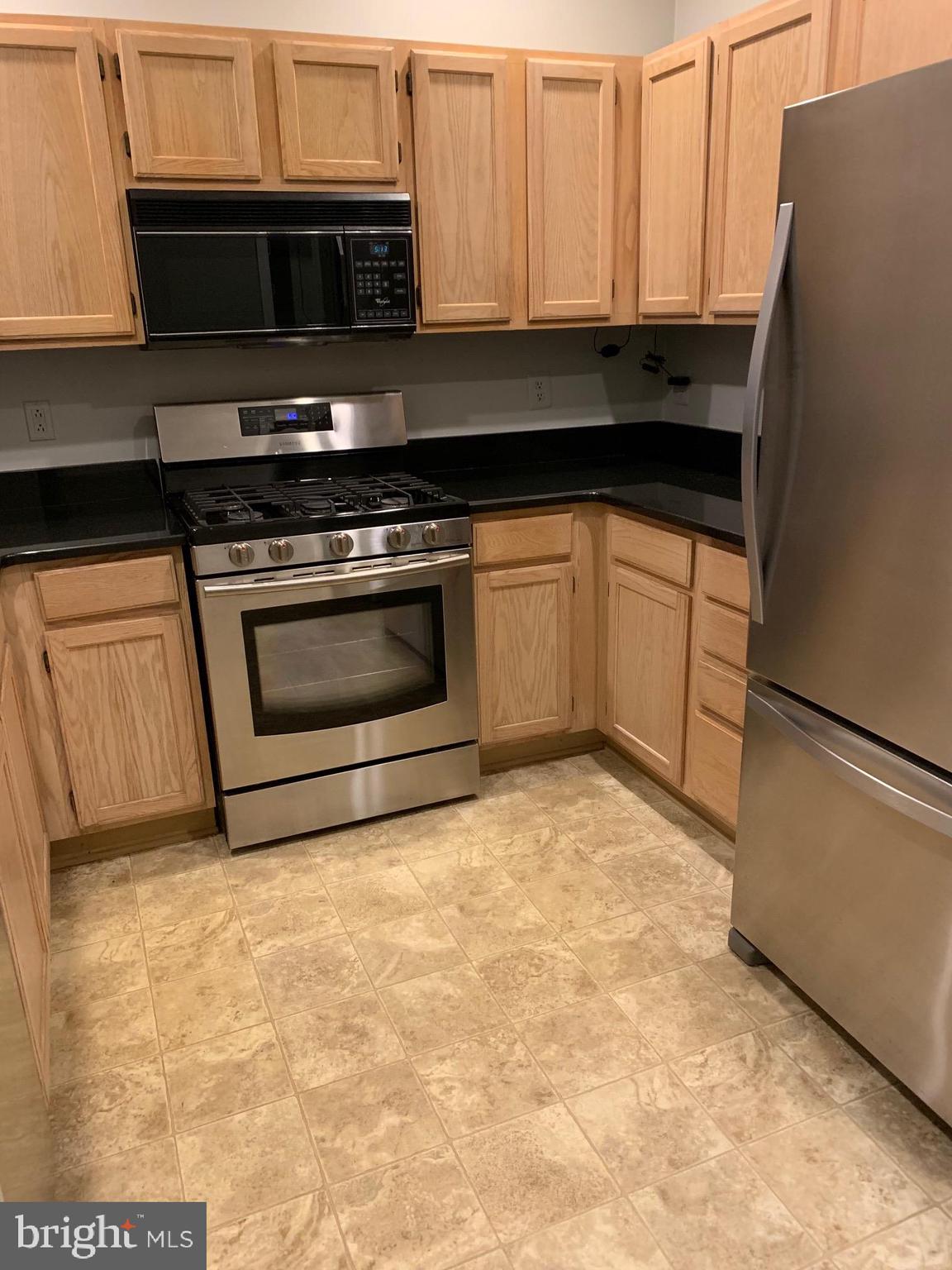 12009 Taliesin Place, Unit 12 Reston, VA 20190 - Photo 4 of 15 Room Kitchen/updated stainless steel appliances