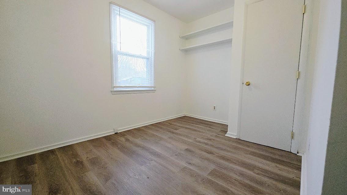 12217 Valleywood Drive Silver Spring, MD 20902 - Photo 17 of 36 an empty room with wooden floor and windows