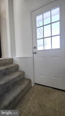 a view of an empty room with a fireplace