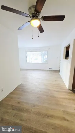 a kitchen with stainless steel appliances granite countertop a refrigerator and a stove