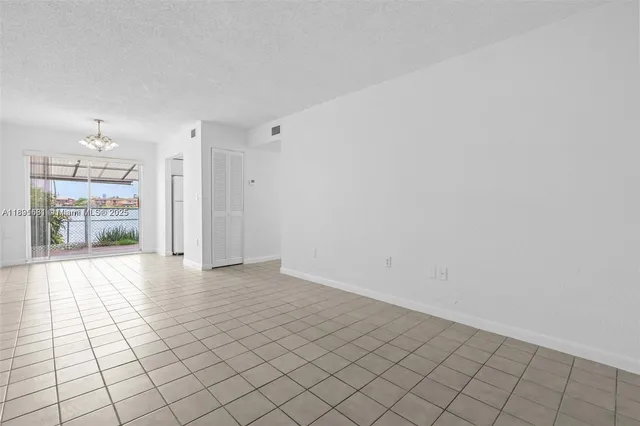 a view of backyard with wooden fence