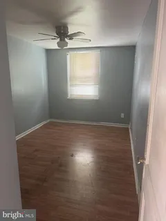 a view of room with window and hardwood floor