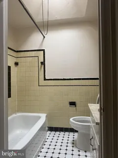 a bathroom with a toilet a sink and shower