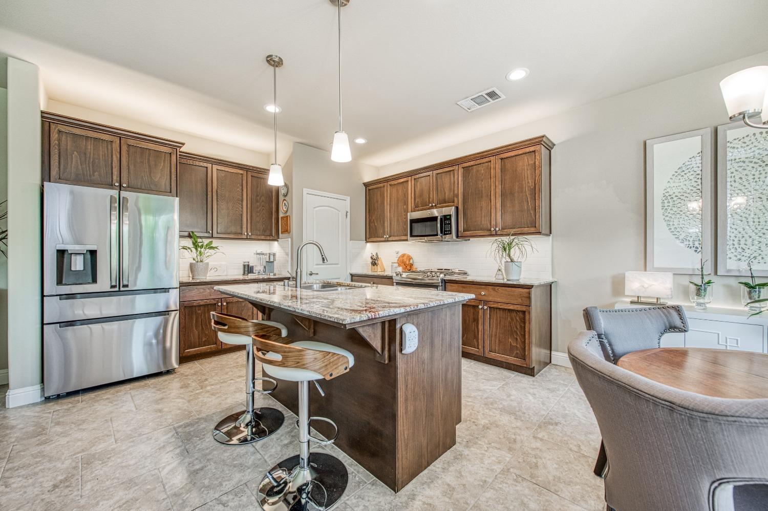 3479 Park Avenue Clovis, CA 93611 - Photo 16 of 27 a kitchen with a sink stove and microwave