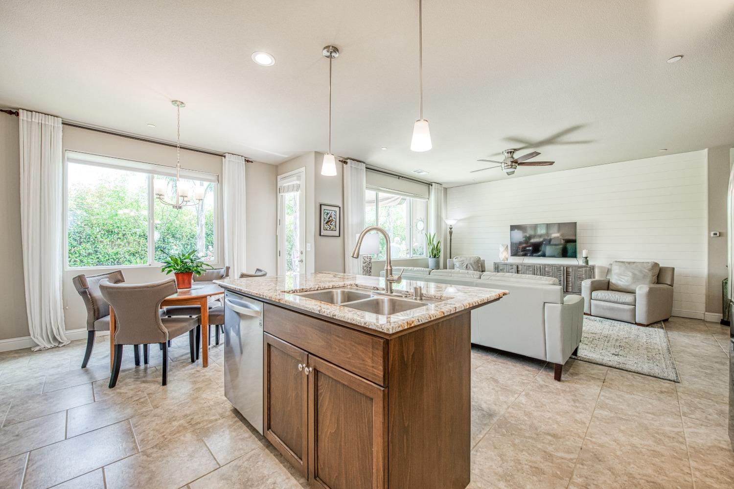 3479 Park Avenue Clovis, CA 93611 - Photo 18 of 27 a kitchen with sink cabinets and wooden floor