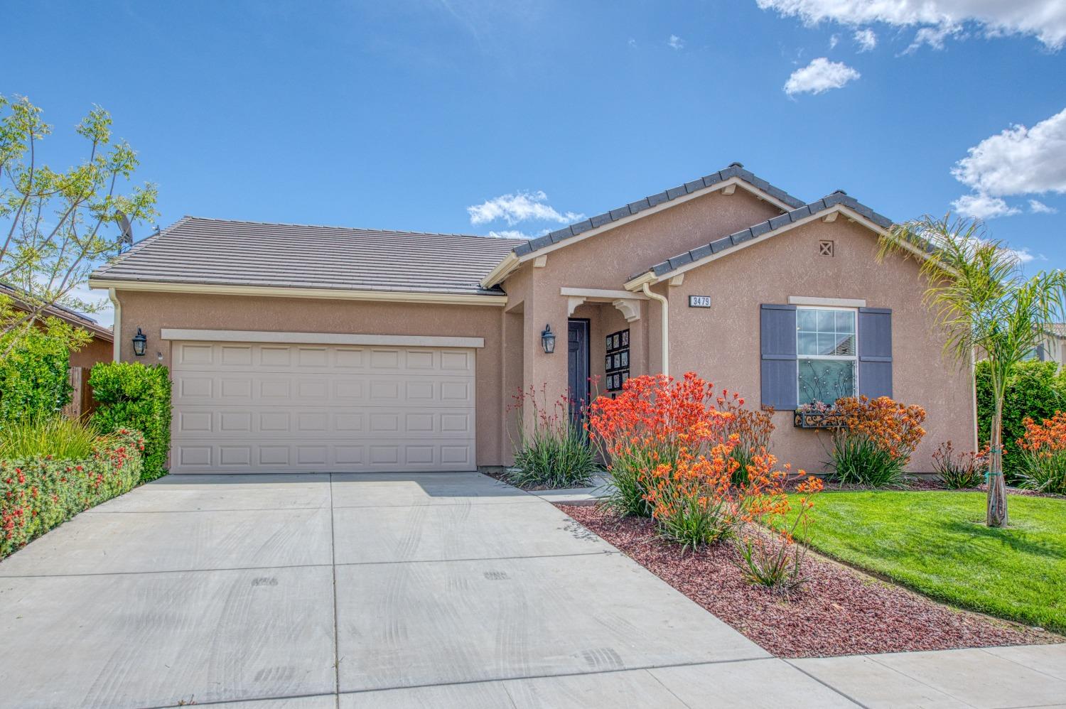 3479 Park Avenue Clovis, CA 93611 - Photo 2 of 27 a front view of house with flower around