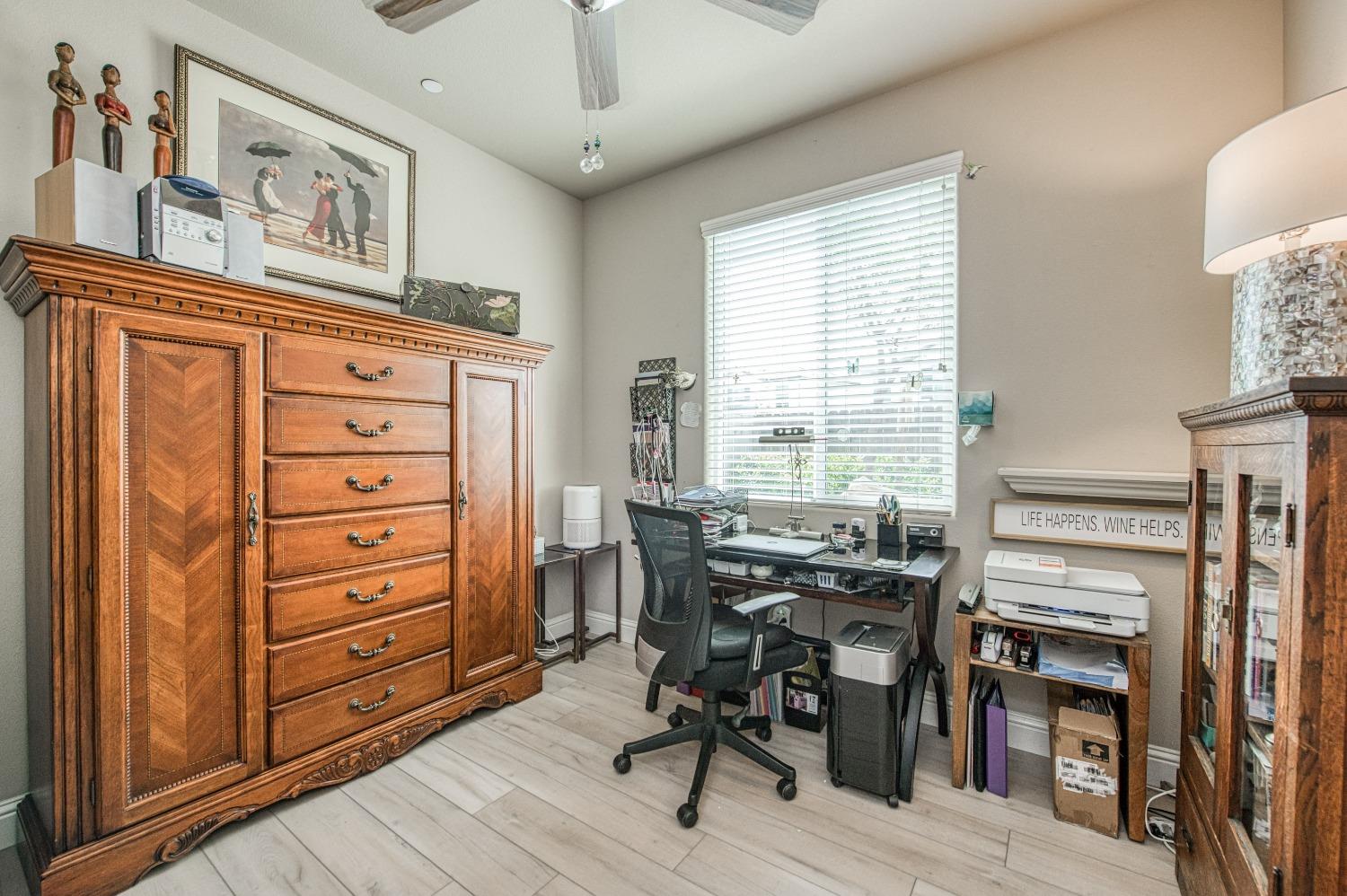 3479 Park Avenue Clovis, CA 93611 - Photo 7 of 27 a view of a workspace with furniture and a window