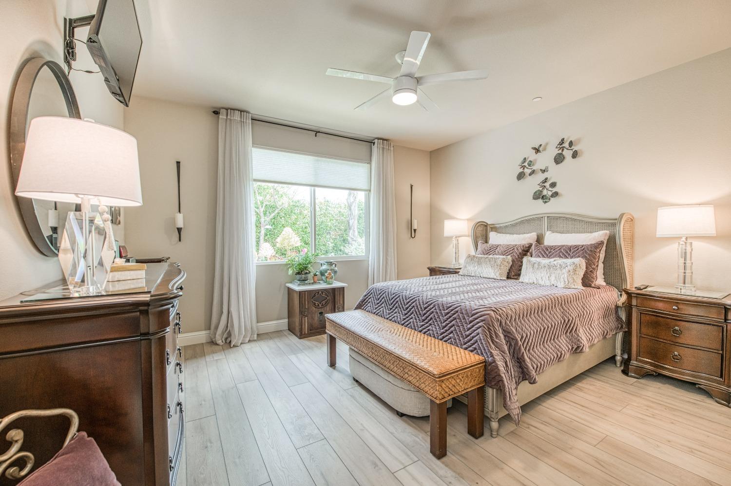 3479 Park Avenue Clovis, CA 93611 - Photo 8 of 27 a bedroom with a bed table chair and a window