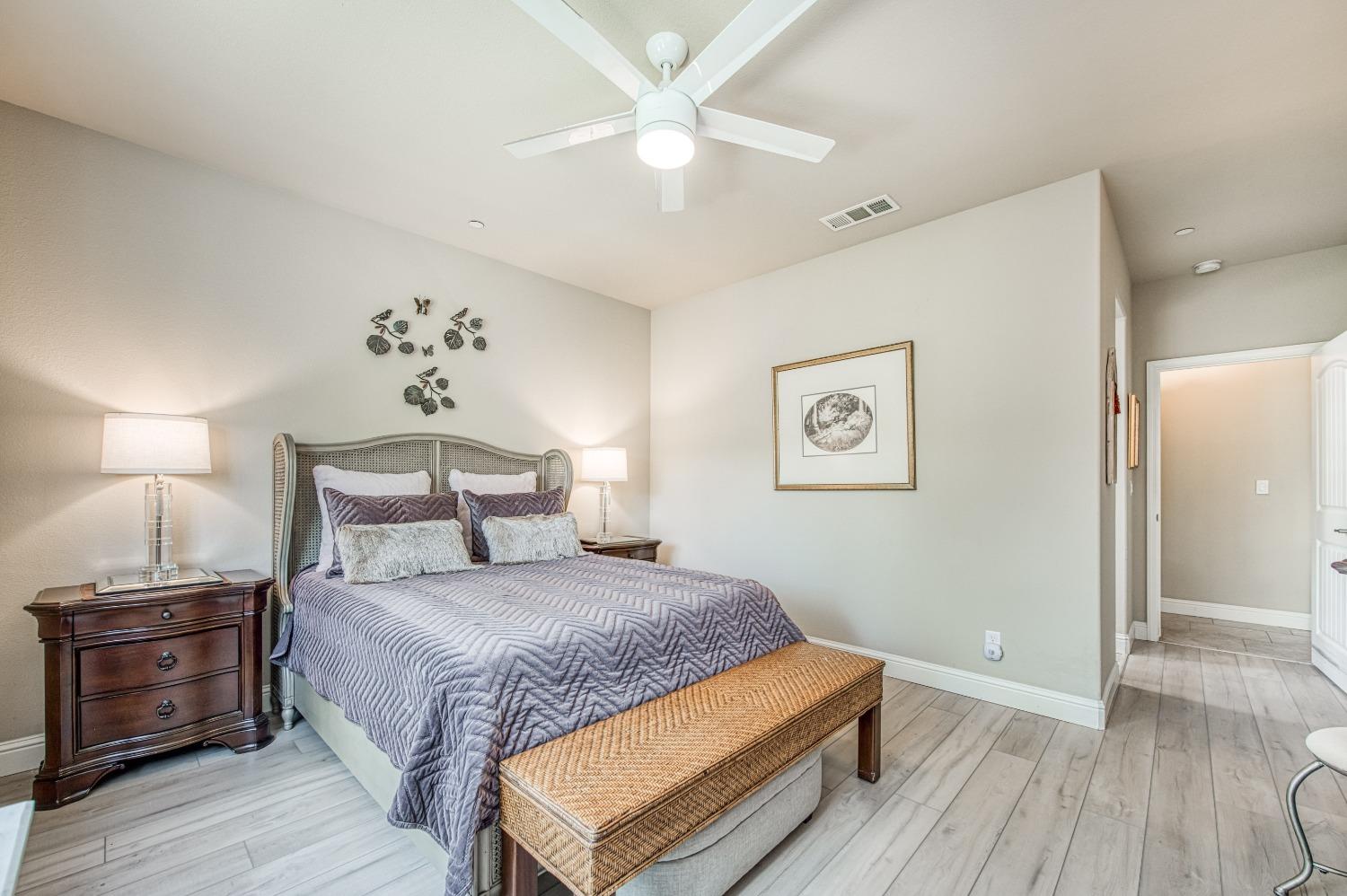 3479 Park Avenue Clovis, CA 93611 - Photo 10 of 27 a bedroom with a bed and wooden floor