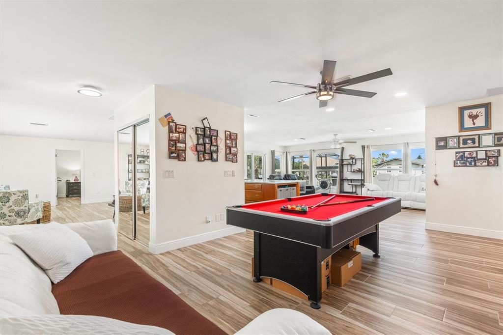 5 Cheyenne Court Palm Coast, FL 32137 - Photo 19 of 61 a living room with furniture a ceiling fan and a rug