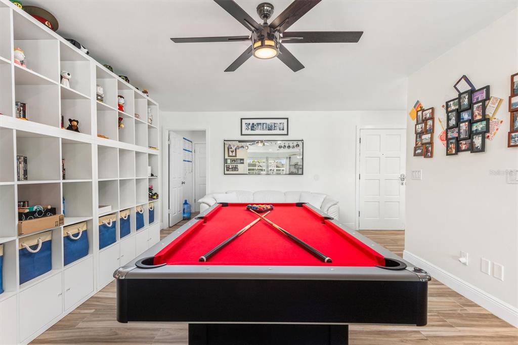 5 Cheyenne Court Palm Coast, FL 32137 - Photo 20 of 61 a room with pool table and book shelf