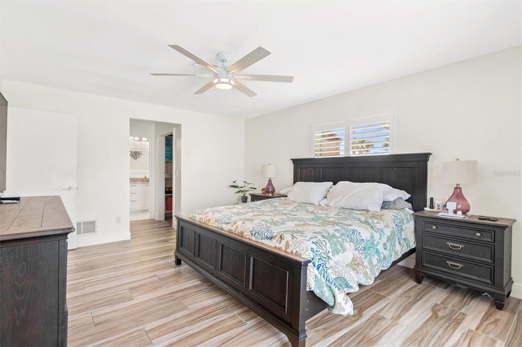 5 Cheyenne Court Palm Coast, FL 32137 - Photo 27 of 61 a bedroom with a bed and a dresser