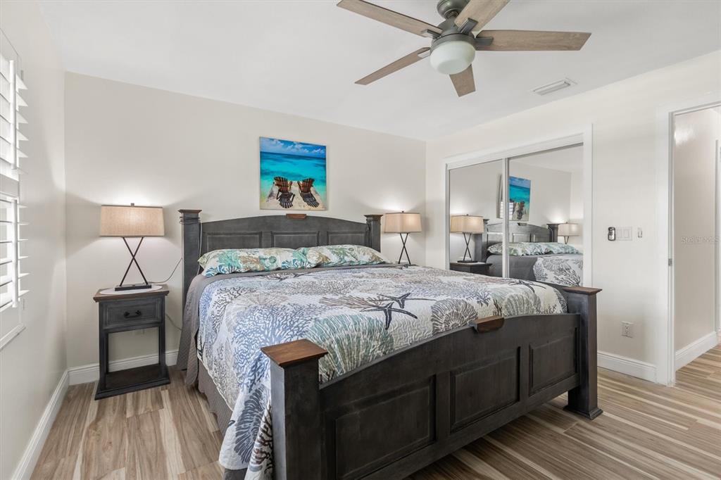 5 Cheyenne Court Palm Coast, FL 32137 - Photo 29 of 61 a bedroom with a bed and a chandelier