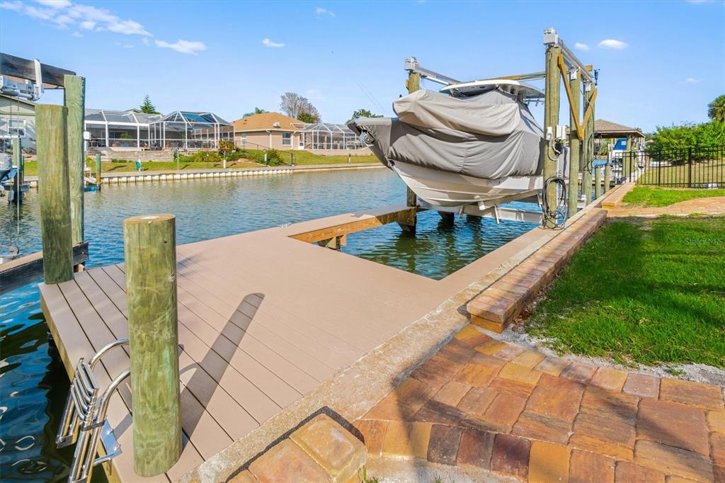 5 Cheyenne Court Palm Coast, FL 32137 - Photo 35 of 61 a view of a swimming pool with a lounge chairs