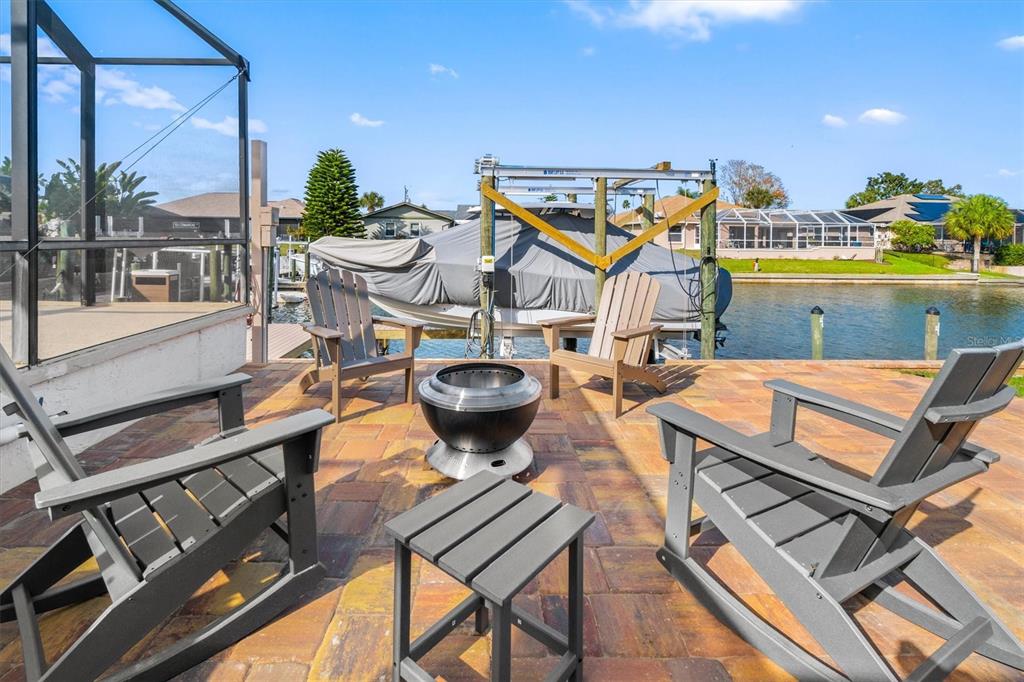 5 Cheyenne Court Palm Coast, FL 32137 - Photo 4 of 61 a view of a patio with table and chairs and potted plants