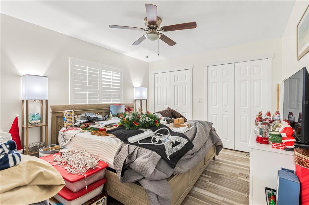 5 Cheyenne Court Palm Coast, FL 32137 - Photo 47 of 61 a bed room with bed and a chandelier