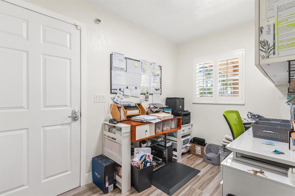 5 Cheyenne Court Palm Coast, FL 32137 - Photo 48 of 61 a view of a workspace with furniture and a window