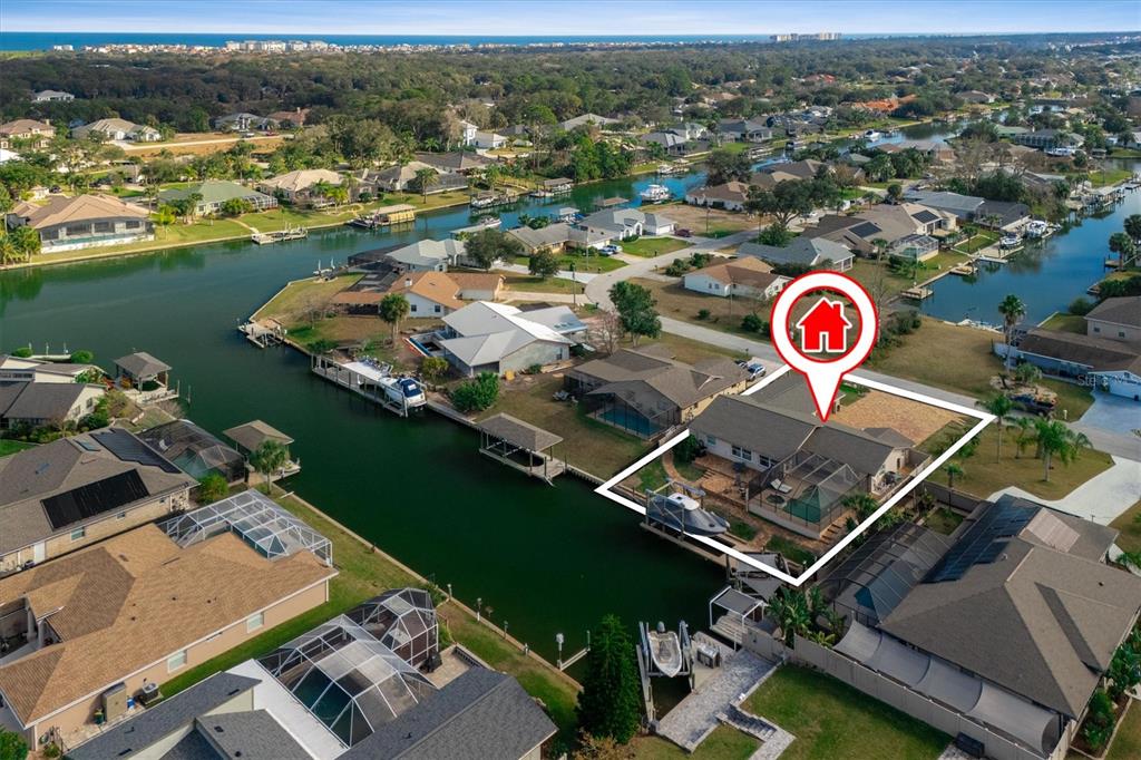 5 Cheyenne Court Palm Coast, FL 32137 - Photo 53 of 61 an aerial view of a house with a lake view