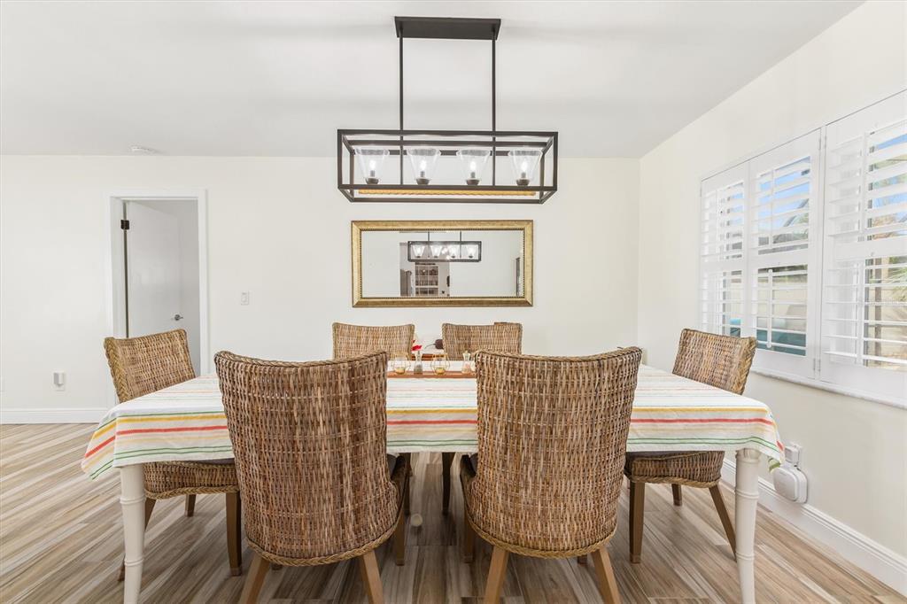 5 Cheyenne Court Palm Coast, FL 32137 - Photo 9 of 61 a view of a dining room with furniture window and wooden floor