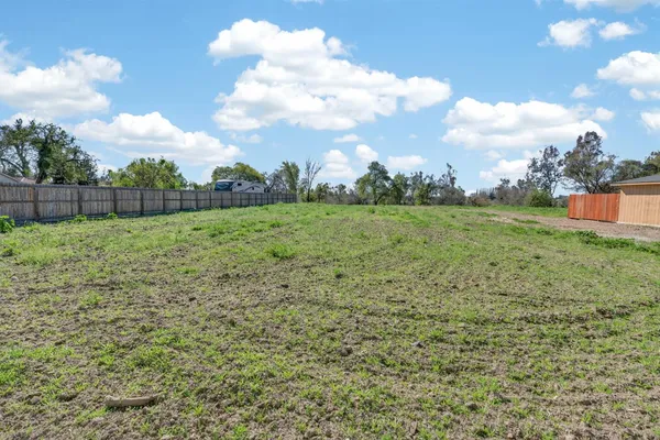 a view of a field with an trees