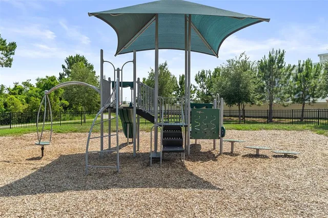 an aerial view of a houses with outdoor space