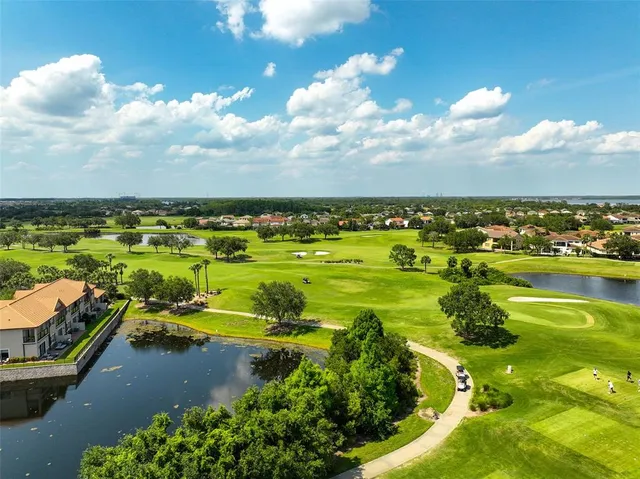 an aerial view of a houses with outdoor space swimming pool and mountains