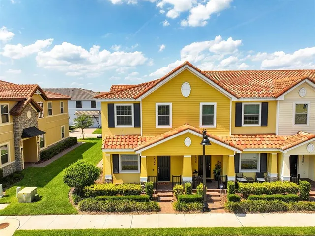 a view of a city with tall buildings and ocean view