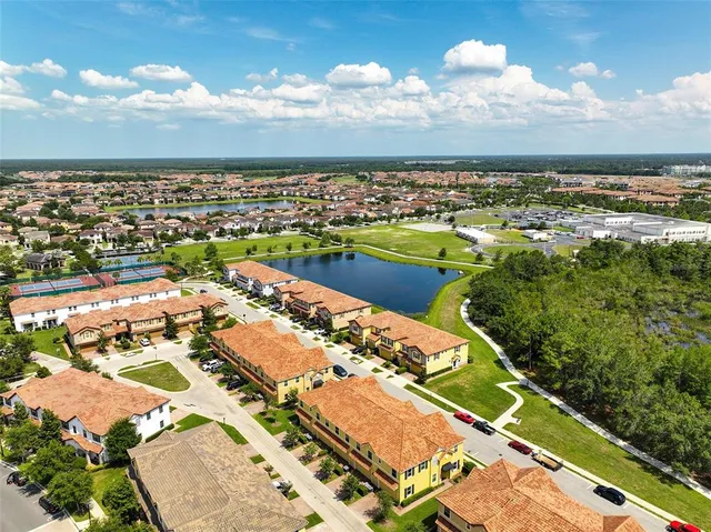 an aerial view of residential houses with outdoor space