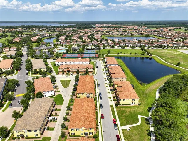 an aerial view of residential building with ocean view