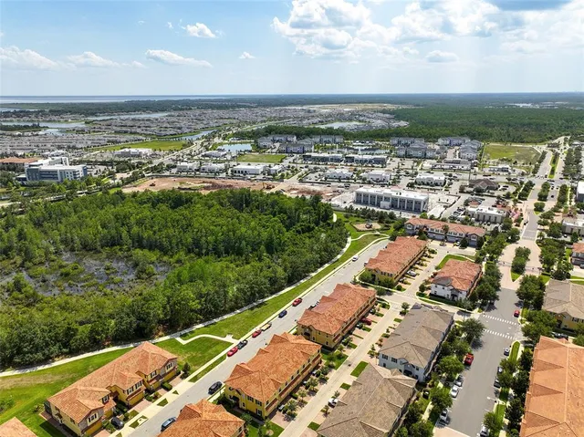an aerial view of a house with a garden