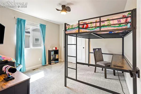 a view of a livingroom with furniture and staircase