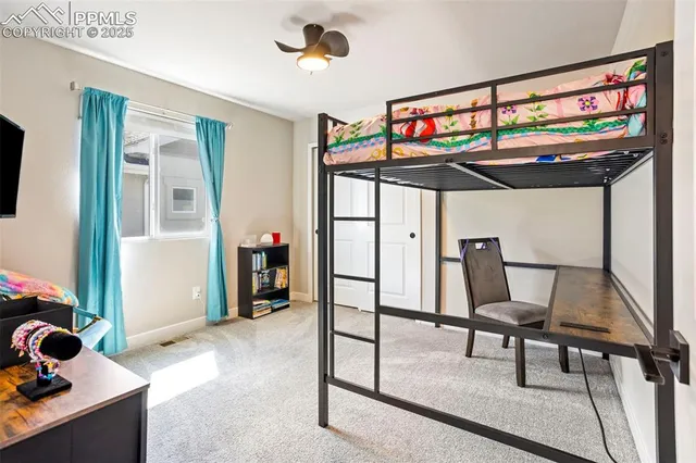 a view of a livingroom with furniture and staircase