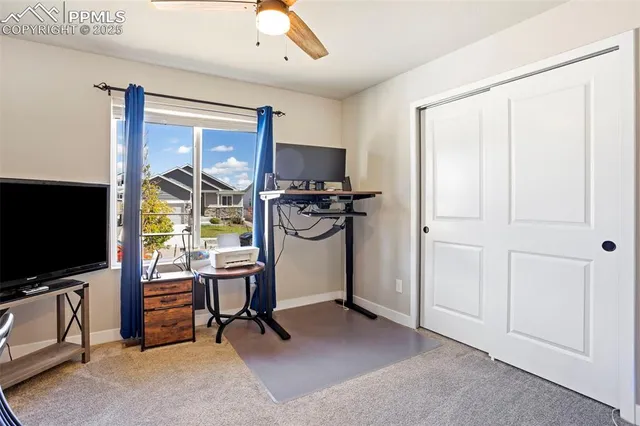 a view of a livingroom with furniture and a flat screen tv