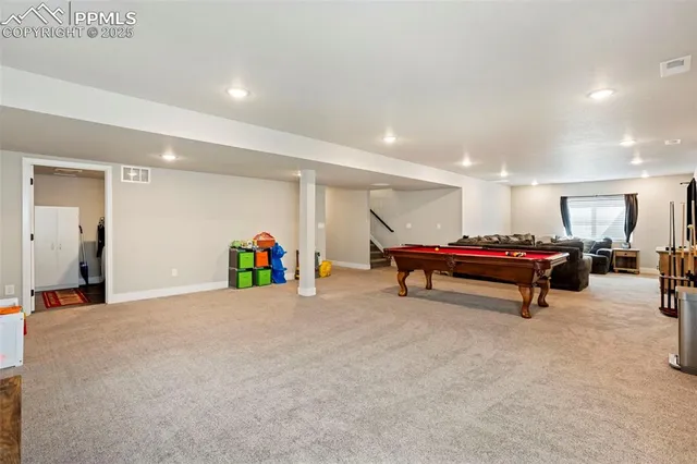 a room with furniture and air hockey table