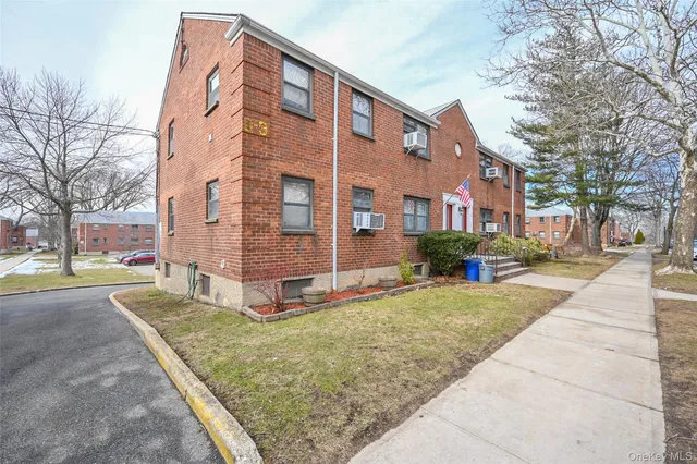 a front view of a building with street view
