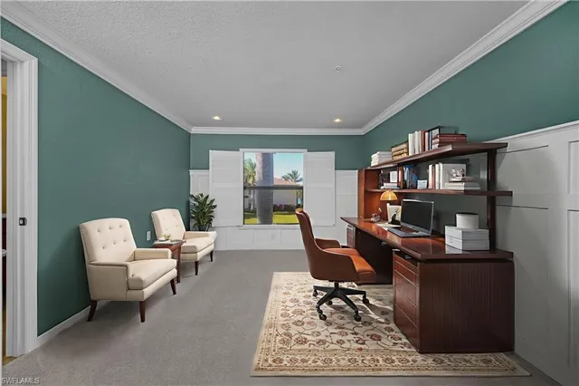 a work room with furniture and a bookshelf