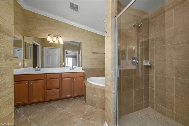 a spacious bathroom with a granite countertop sink a toilet and shower