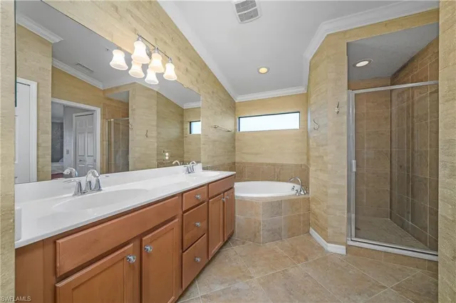 a spacious bathroom with a double vanity sink mirror double and shower