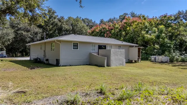 a aerial view of a house with a yard and garage
