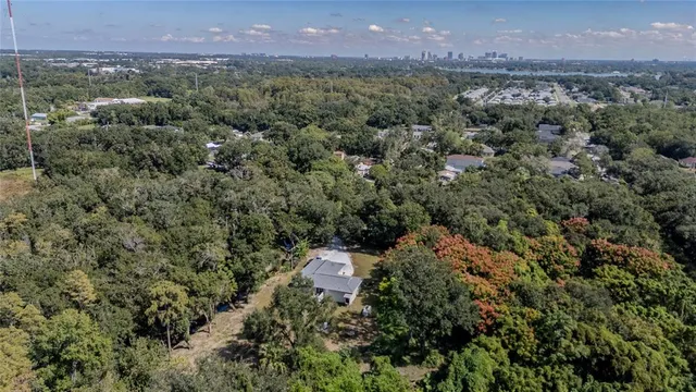an aerial view of a house with a yard