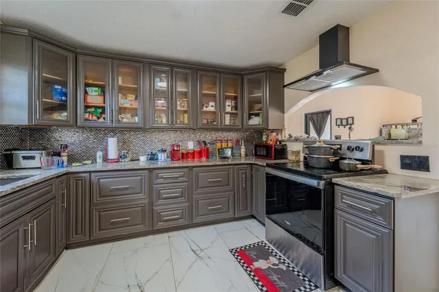 a bathroom with a sink a toilet a mirror a vanity and shower