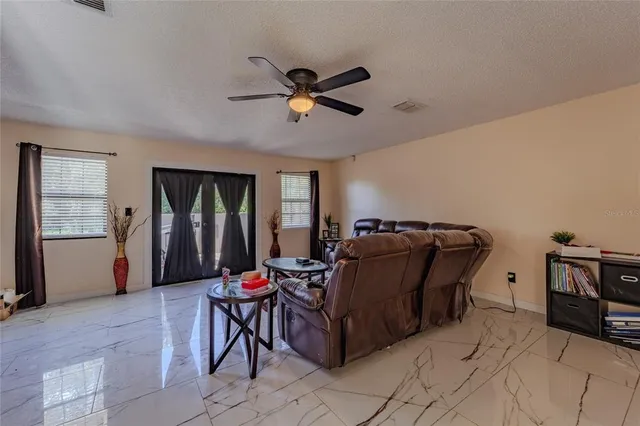 a living room with furniture and a window