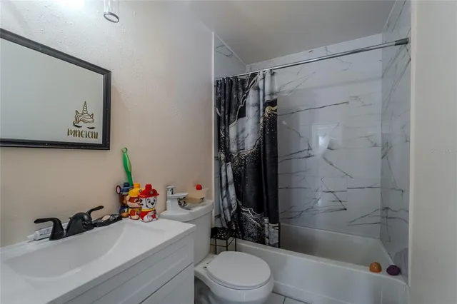 a bedroom with bed and window