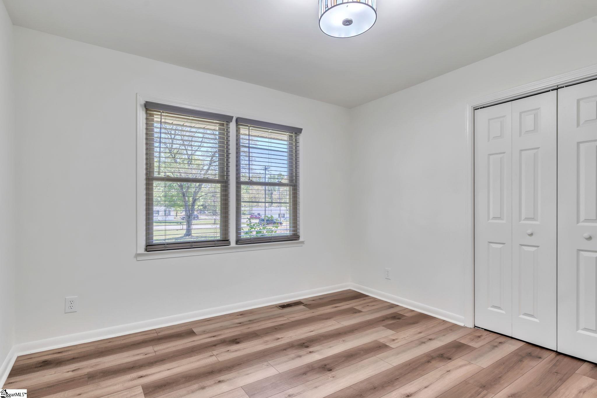 745 Canterbury Trail Fountain Inn, SC 29644 - Photo 13 of 25 Bedroom 2 has LVP flooring, double pane windows, and large closet.