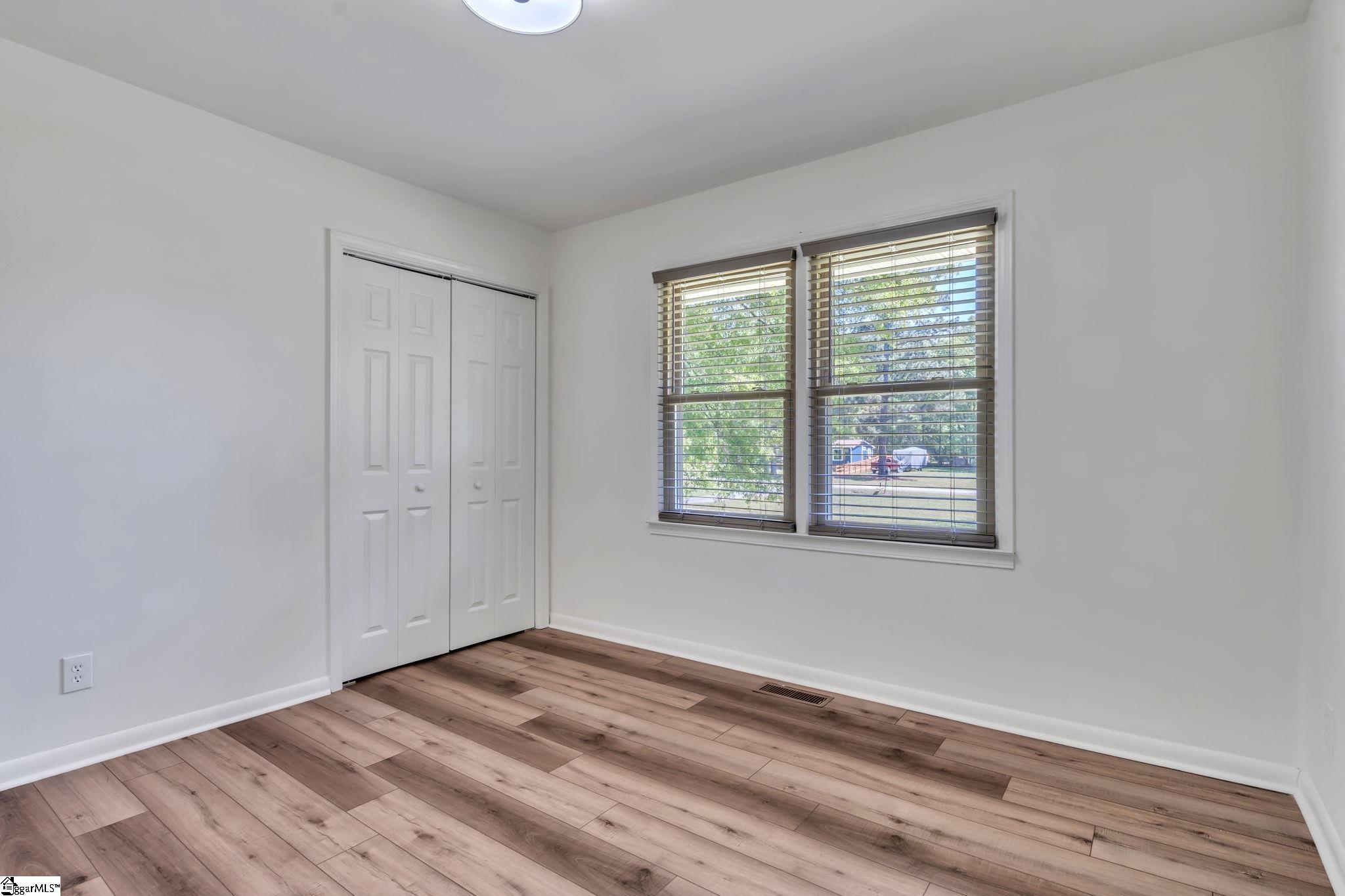 745 Canterbury Trail Fountain Inn, SC 29644 - Photo 15 of 25 The third bedroom also has double pane windows, LVP flooring, and nice closet.