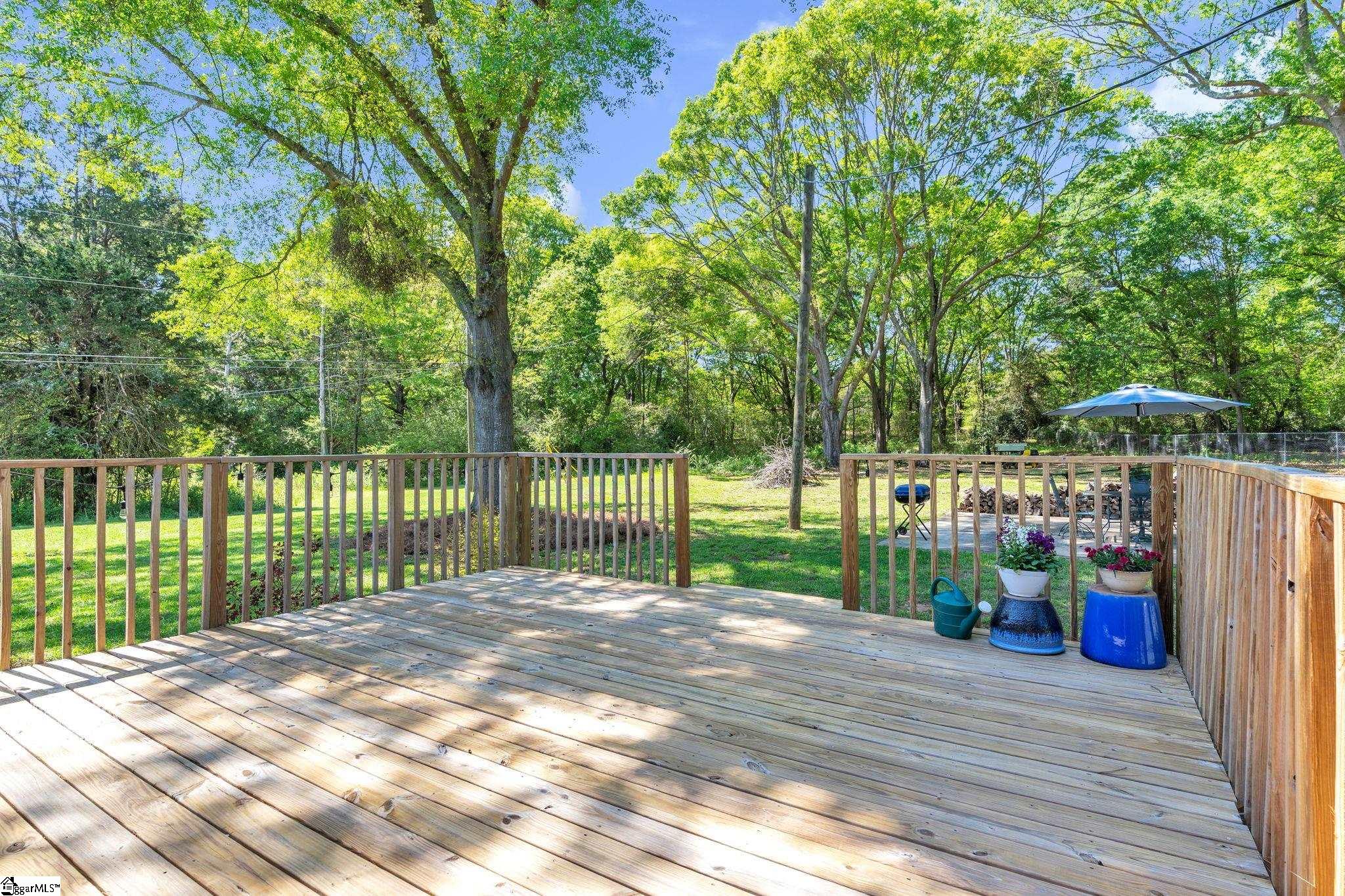 745 Canterbury Trail Fountain Inn, SC 29644 - Photo 18 of 25 Want to grill out, dine out? Choose from your deck or large patio- both overlooking the parklike backyard.