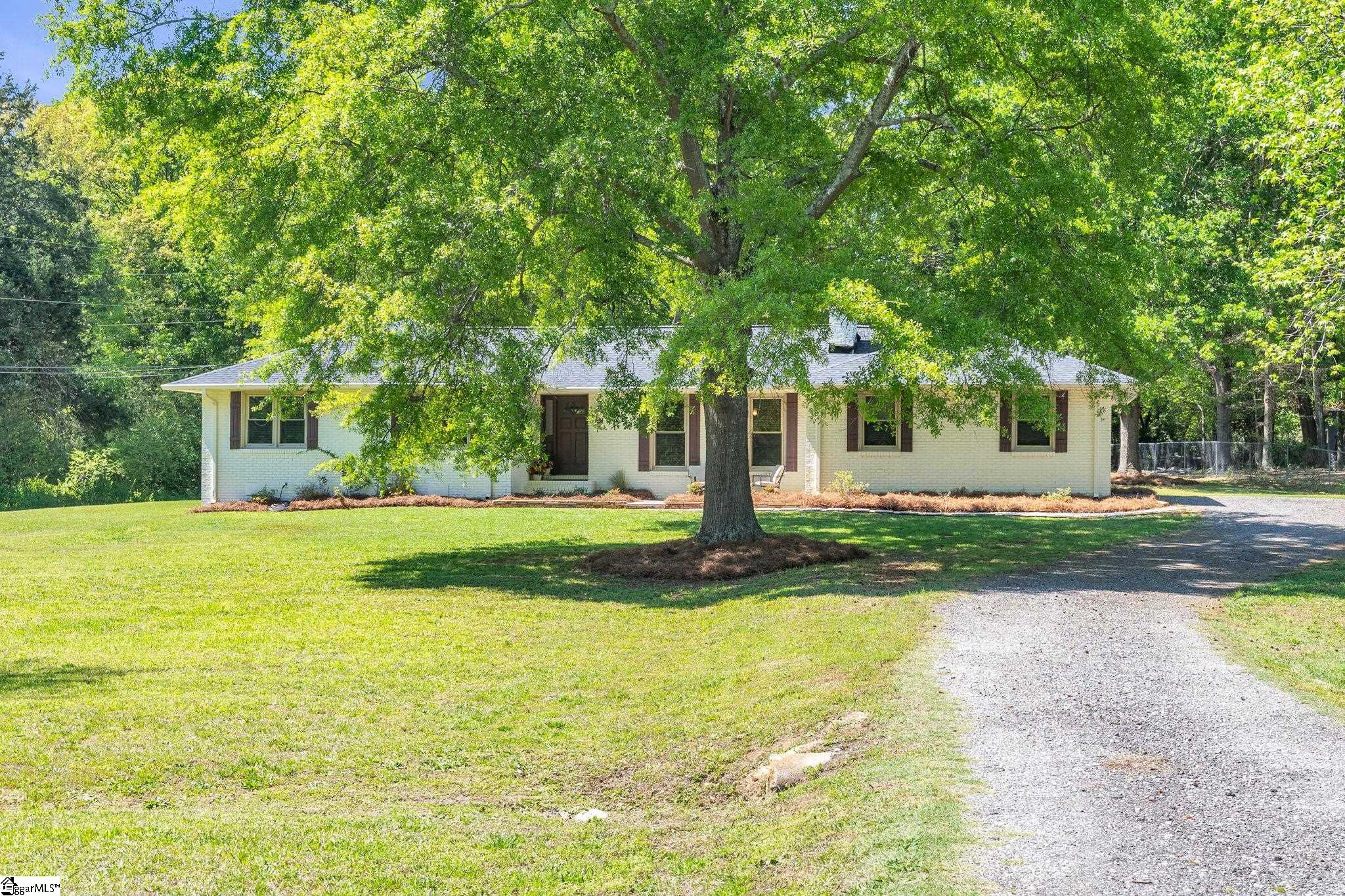 745 Canterbury Trail Fountain Inn, SC 29644 - Photo 2 of 25 Sitting on almost two acres this property has large front yard, plenty of parking for guests or recreational vehicles and huge back yard too!