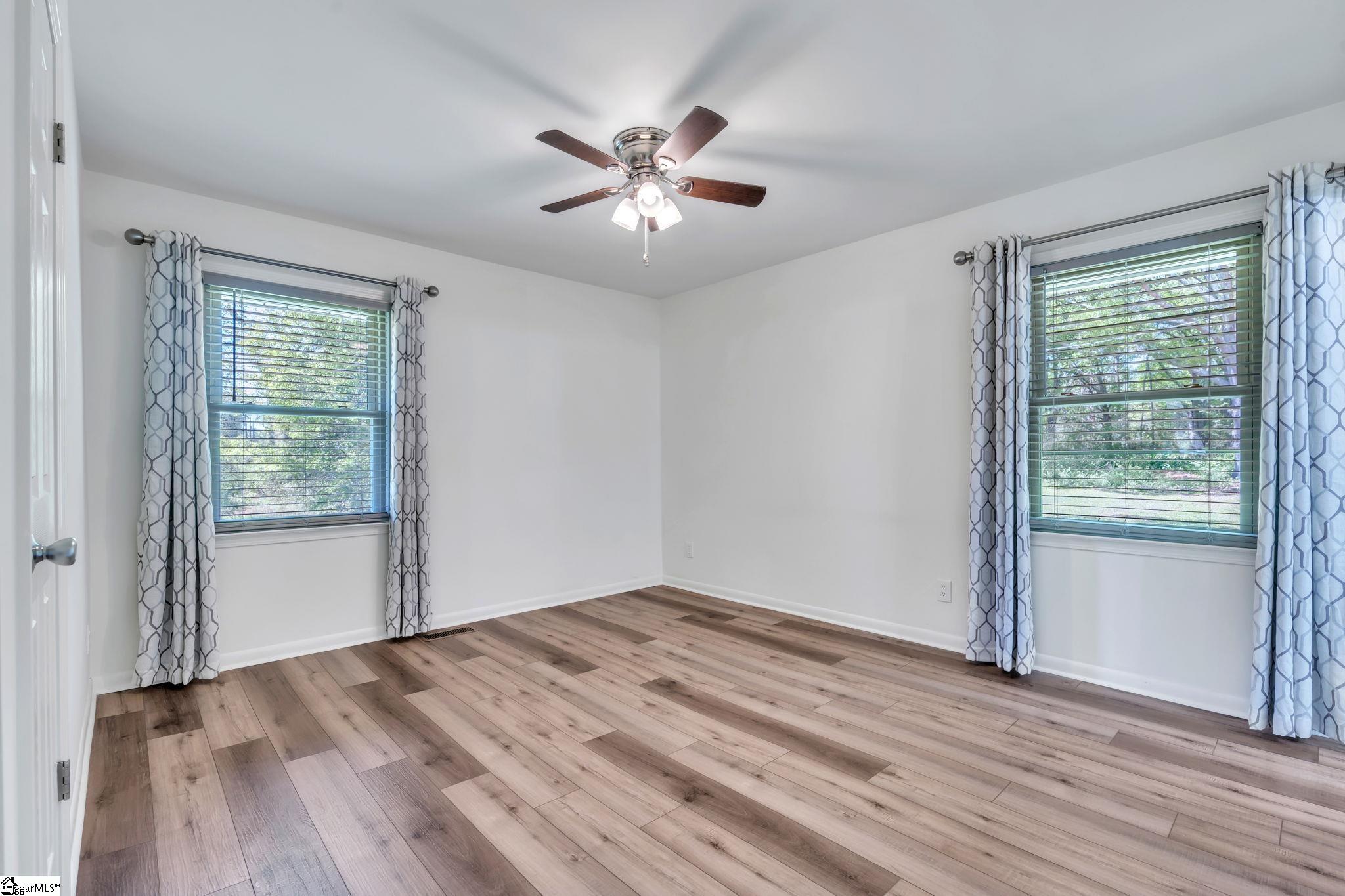 745 Canterbury Trail Fountain Inn, SC 29644 - Photo 9 of 25 Has LVP flooring, walk in closet plus additional closet, and ensuite bathroom.